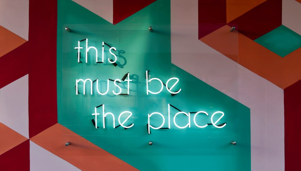 A neon sign saying 'this must be the place'